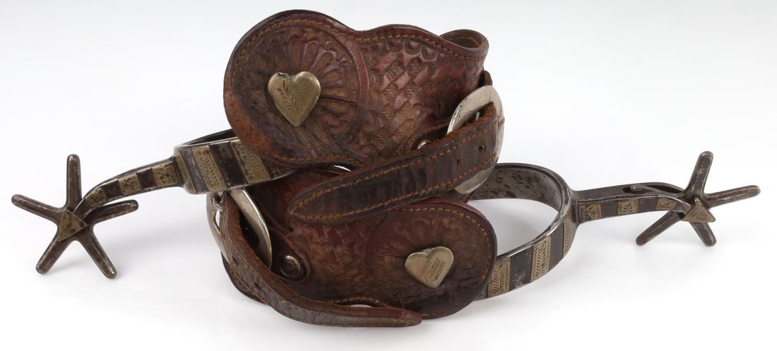 ANTIQUE PAIR OF KELLY BROTHERS SPURS: 2 1/4 inch rowels. Arms measure 3 1/4 inches. Full length is 9 1/4 inches. Marked KELLY BROS on right arm. This lot has a reserve.