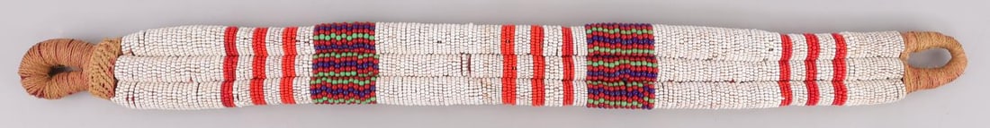 ANTIQUE PLAINS INDIAN BEADED SADDLE CINCH BELT: Early 20th century triple row beaded, measures 29 inches.