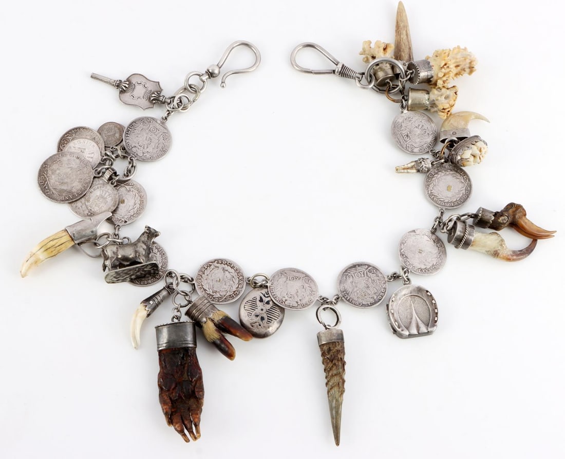 SILVER BAVARIAN CHARIVARI CHAIN MANY ADORNMENTS: Antique, features many adornments. These were passed down through generations. Measures 18 1/4 inches. Silver coins, and other silver items Weight: MT R