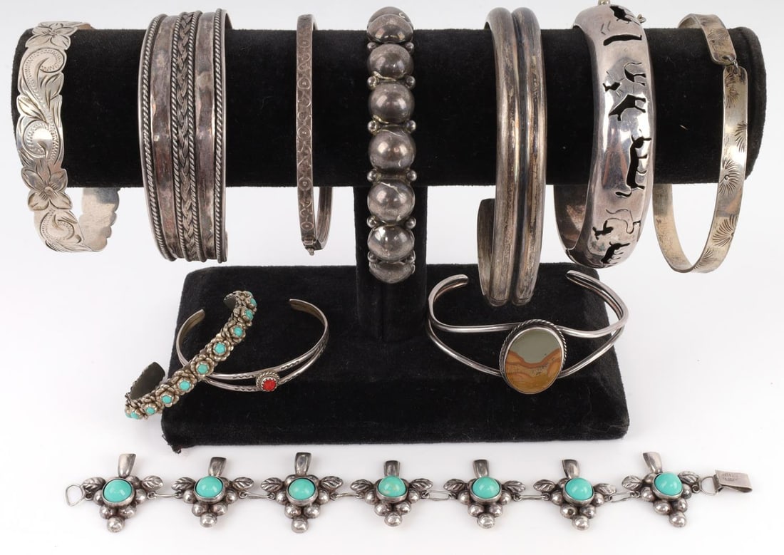 OLD PAWN NATIVE SOUTHWESTERN STERLING BRACELETS: Lot of 11 assorted vintage Southwestern and Native American sterling silver bracelets and cuffs, including Native American made child cuffs and a large men's old pawn cuff. Total weight 201 grams. Thi