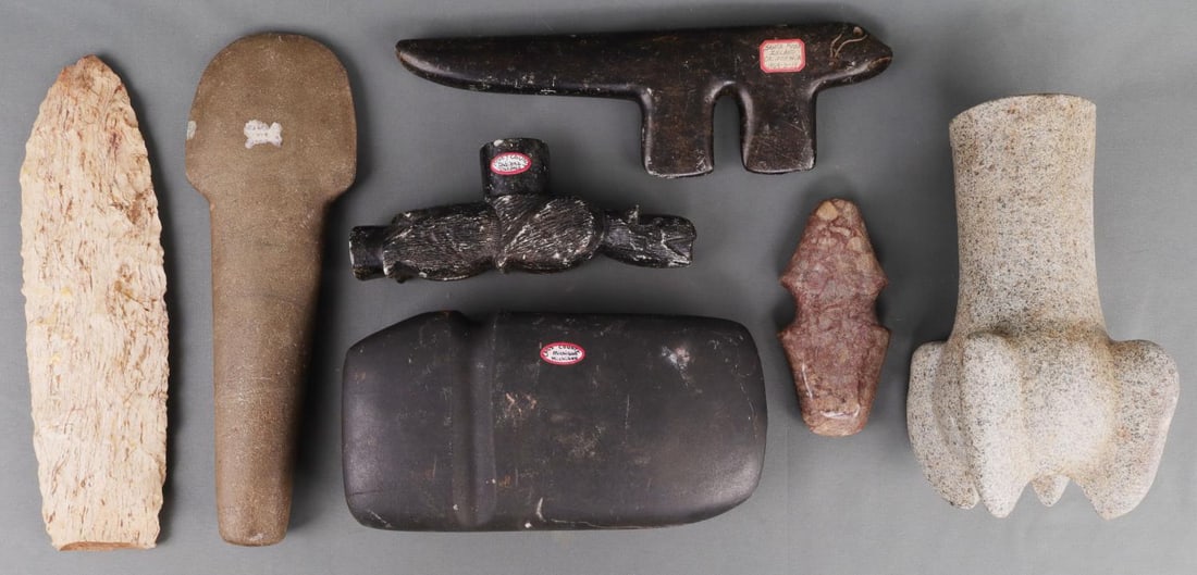 LOT 7 VINTAGE NATIVE AMERICAN CARVED STONE TOOLS: Lot of seven (7) Vintage Native American carved stones including axe heads, an animal effigy, a pipe, and some kind of grind stone with points. Axe heads are from Cass County Michigan and Allen County