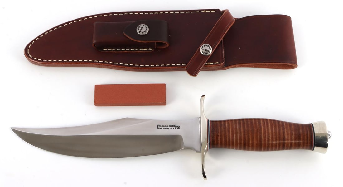 RANDALL MADE KNIFE MODEL 12 BEAR BOWIE W SHEATH: Model 12 Bowie has an 8-inch stainless steel blade of 1/4 inch stock. 1 5/8 inch wide. The top cutting edge is sharpened approximately 5 1/4 inch. Brass double forward curved hilt. Approximately 5-inc