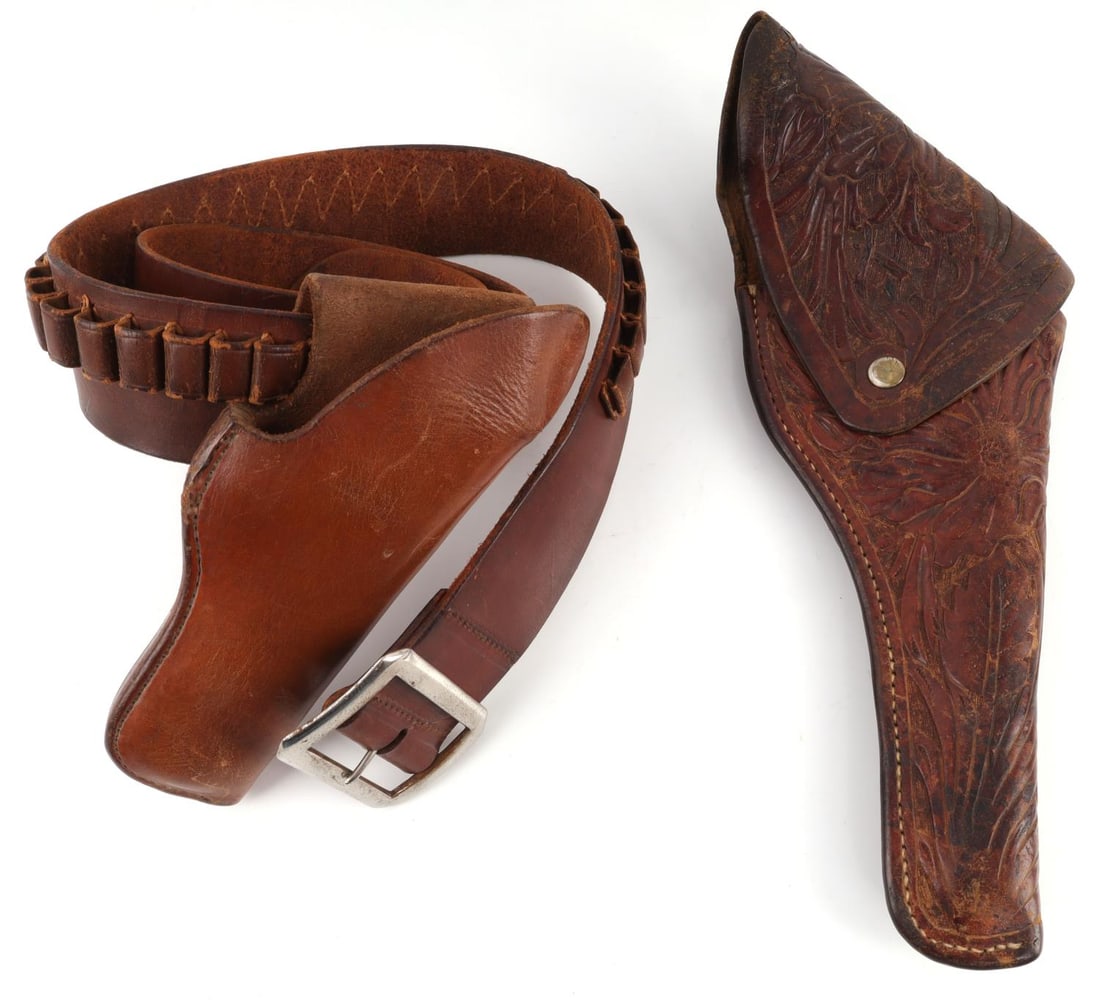 2 VINTAGE LEATHER HEISER & VAUGHAN GUN RIG HOLSTER: Lot of two (2) vintage leather holster and gun rig belt. Leather holster features a manufacturer stamp that reads, "RUSS VAUGHN, MAKER, RENO, NEV." This holster features floral designs and a leather b