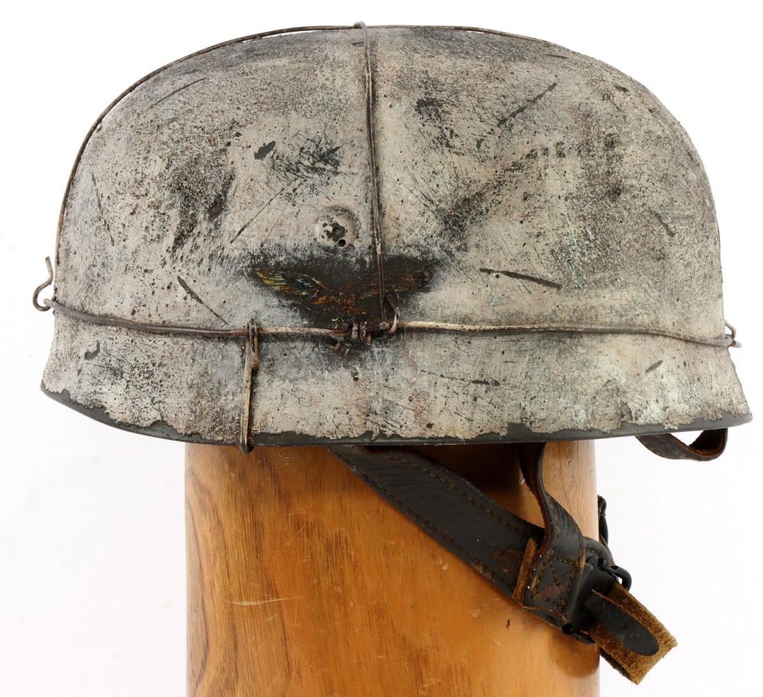 WWII GERMAN THIRD REICH FALLSCHIRMJAGER CAMO M38: WWII German Fallschirmjager Camo and wire, Paratroopers M38 helmet. Liner and chin strap leather is supple and shows signs of normal wear. Double decal Luftwaffe eagle and tricolor shield. The whitewa