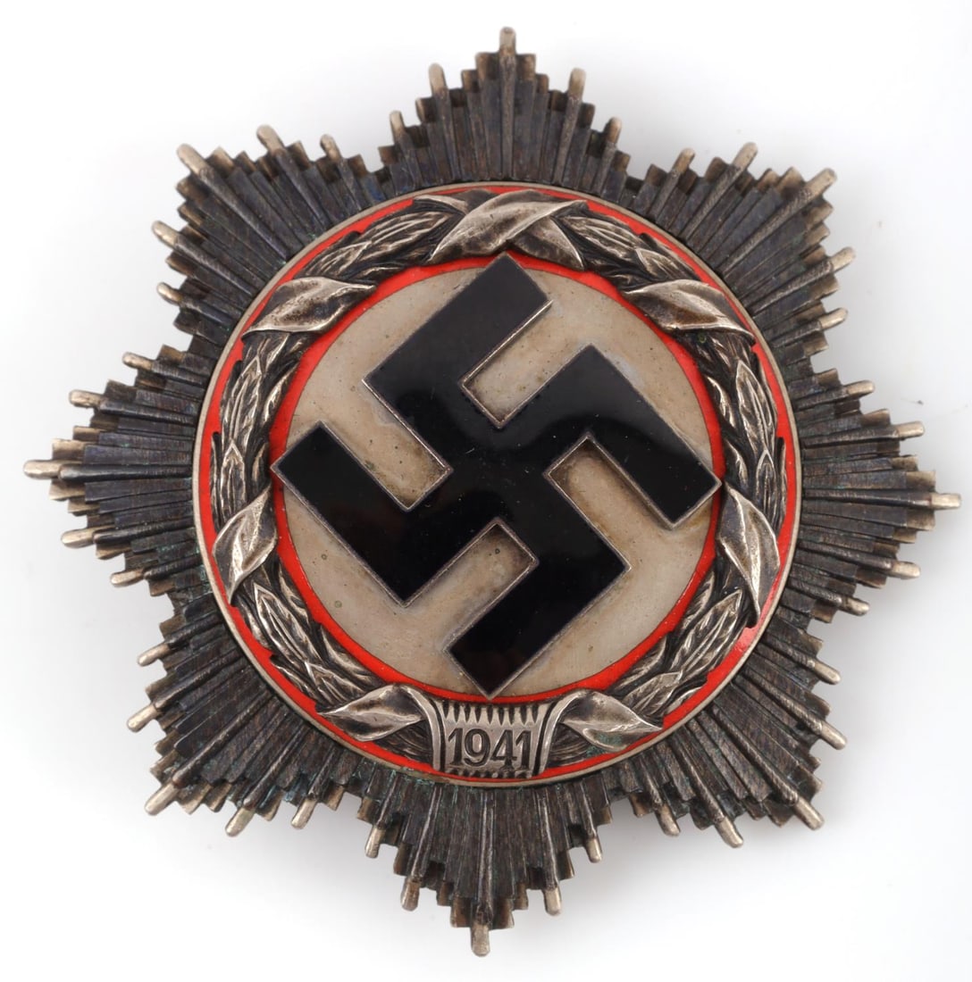 WWII GERMAN REICH SILVER ORDER OF THE GERMAN CROSS: WWII German Reich Silver Order of the German Cross(Deutches Kreuz) medal. Vertical 90 degree pinback with four rivets. Reverse is stamped, "134" for manufacturer Otto Klein in Hanau. Cross size approx