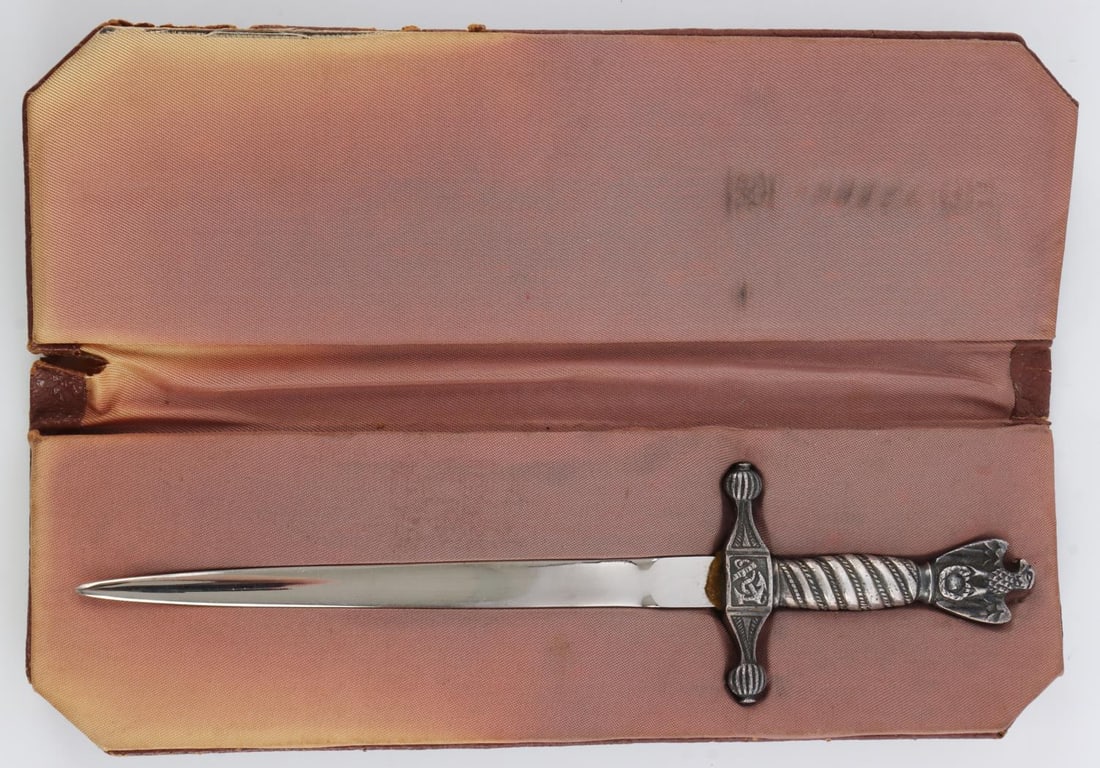 WWII GERMAN KRIEGSMARINE DAGGER LETTER OPENER: Steel blade with nickel plating. Grip is a non-magnetic metal. It measures 8 1/8 inches. Comes in carrying case. This lot has a reserve.
