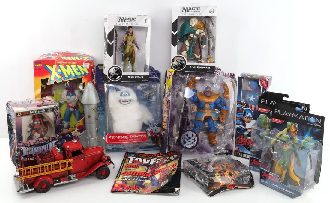 ASSORTED TOY LOT TIN FIRE TRUCK AVENGER ACTION: Assorted toy lot. Vintage tin fire truck that's been painted. Tin Rocket ship bank. Darkchylde The Legacy, Mystique, Abominable Snowman from Rudolph, Avengers Hero Smart, Villain Smart, Captain Americ