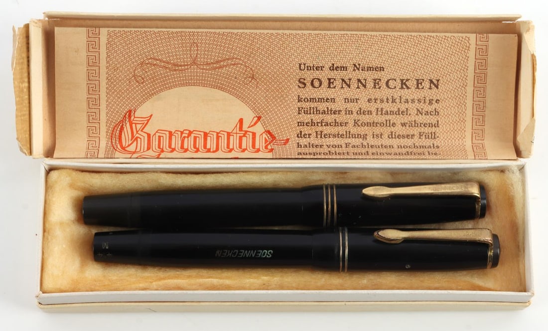 SOENNECKEN 414 FOUNTAIN PEN 14K NIB SET OF 2: Set of 2 Soennecken Nr. 414 fountain pens with original box and manufacturer's certificate of authenticity. Nibs are engraved "14k. 585 Soennecken." Blind caps are stamped "414 M." Exterior condition 