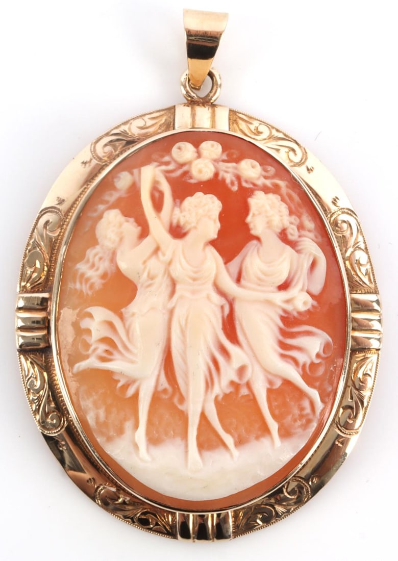 14KT GOLD EDWARDIAN CAMEO W 3 SISTERS DANCING: Hand tooled gold edge with nice bale and detailed center portrait of 3 ladies dancing in the garden. Total weight 9 grams. Length 5cm, width 3.5cm. This lot has a reserve.