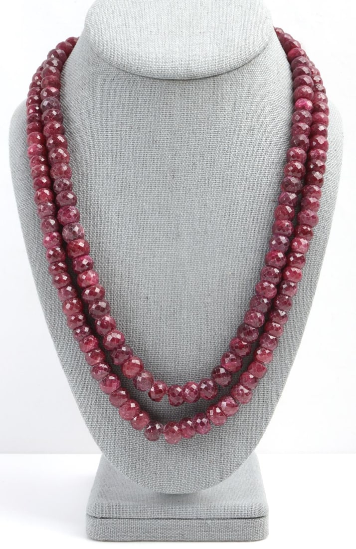 BURMESE FACETED RUBY NECKLACE TWO STRAND: Each stone measures approximately 9.5 millimeters by 6.7 millimeters. Fabric, adjustable end is in tact. Necklace is overall in very good condition. This lot has a reserve.