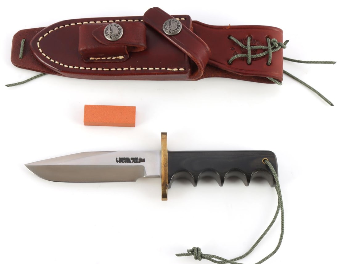 RANDALL MODEL 14 MINI ATTACK KNIFE: Randall model 14 mini with serial number 2052. Measures 6 5/8 inches overall. Brass finger-guard with Micarta grip. Comes with para cord thong and leather sheath. This lot has a reserve.