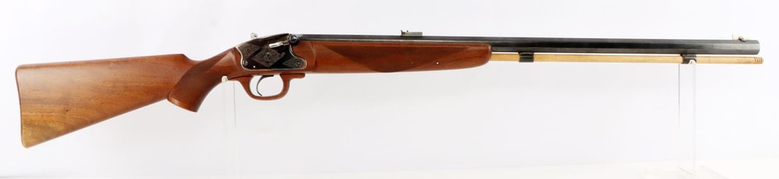THOMPSEN CENTER ARMS HAWKEN PERCUSSION RIFLE: Needs spring replaced. Hammer cocks, but mechanism does not swing forward with enough power to hit percussion nipple. Bore is mostly dark with some surface loss. Barrel measures 28 inches long. Exteri