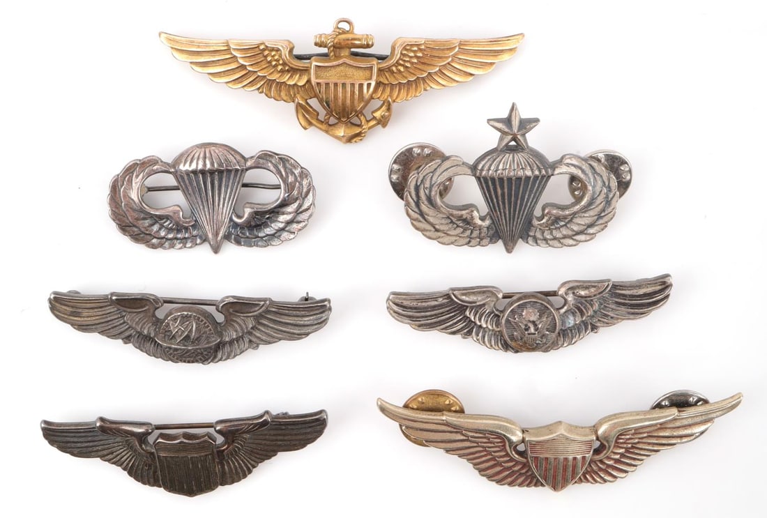 WWII ARMY NAVY AIR FORCE WINGS BADGE LOT OF 7: Lot of 7 WWII and post-war US Armed Forces badges. Includes Balfour pin-back US Naval Aviator Badge (2.75 inches, reverse stamped V20-10K LGB), clutch-back US Army Aviator Badge (2.5 inches, reverse s