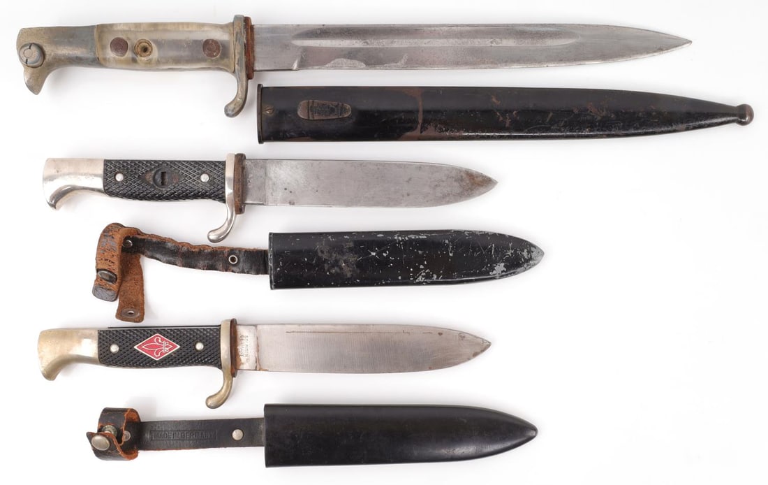 3 WWII GERMAN K98 BAYONET & HITLER YOUTH KNIFE LOT: Lot of 3 (three) WWII German Reich edged weapons including a K98 bayonet and two Hitler Youth daggers, all with a scabbard. K98 features clear grips, single hilt, and a ricasso marked "SOHN SOLINGEN".