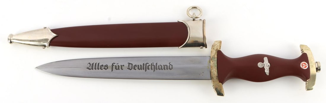 WWII GERMAN THIRD REICH SA DAGGER AND SCABBARD: WWII German Third Reich SA dagger and scabbard. The blade has a makers mark of Boker Solingen. On the reverse side "alles fur deutchland" is inscribed. Blade length is 8.25 inches total length is 14.2