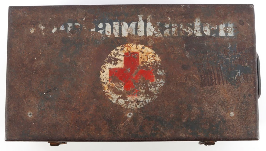 WWII GERMAN VEHICLE FIRST AID KIT MEDIC DOG TAG: WWII German Wehrmacht vehicle first aid kit (Verbandkasten). Includes Box, Medic's Dog tags, Medic pin and bandages. Size: 7.5 X 14 X 5 inches. Kit is not complete and there is some surface rust on th