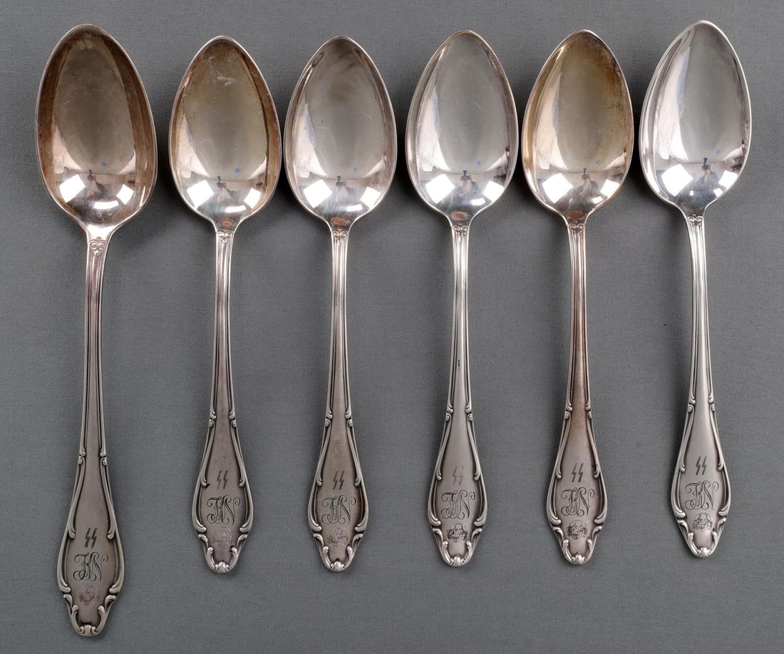 6 WWII GERMAN REICH WAFFEN SS LARGE SPOONS LOT: Lot of six (6) WWII German Reich Waffen SS Large spoons. Handles feature SS runes, the intials "KN", and the totenkopf skull. The reverse is marked, "WELLNER 90", and has the SS runes and letters "WVH