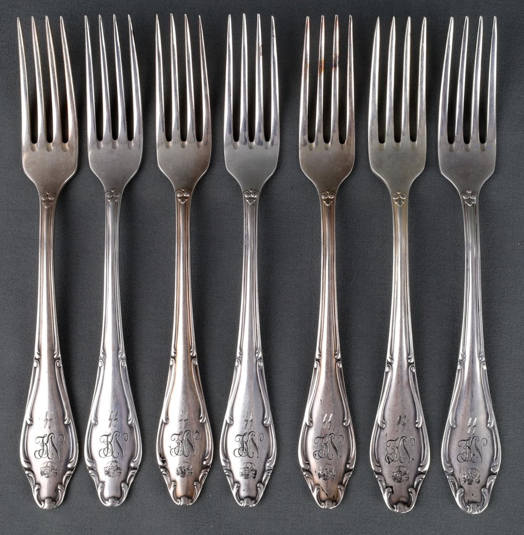 WWII GERMAN THIRD REICH SS WELLNER FORK LOT OF 7: Lot of 7 WWII German dinner forks. Stamped SS Neuengamme concentration camp and Wellner on the reverse. All are in very good conditon. Unauthenticated and sold "as is."
