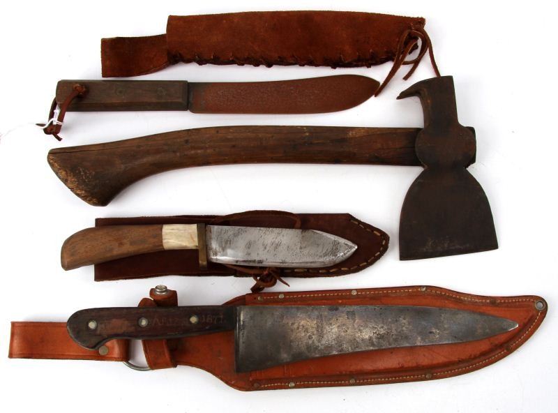 THREE VINTAGE KNIVES AND ONE VINTAGE HATCHET: All three knives include leather scabbard, one is hand-sewn leather. One knife has 1871 inscribed on the handle. The hatchet is 15 inches long the length from blade to bake side hammer is 6.5 inches.