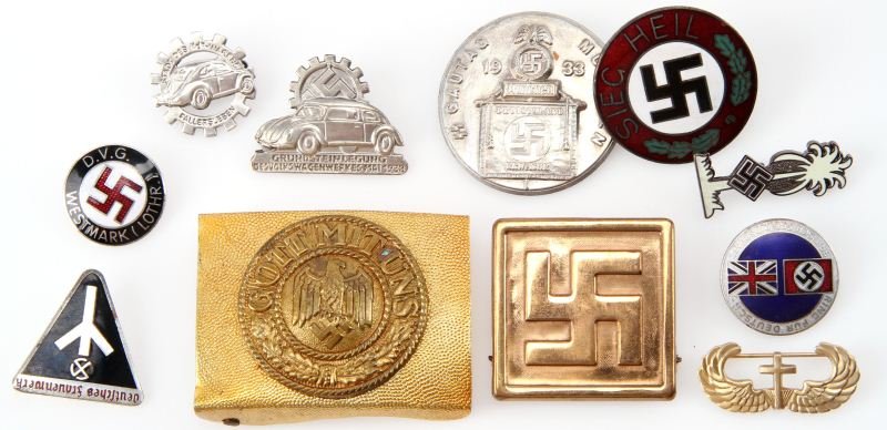 WWII GERMAN PARTY PINS BELT BUCKLE AND MORE: All deemed spurious,"variety" pack of Nazi pins and buckles with one U.S. Airborne Chaplain wings marked sterling but of base metal.