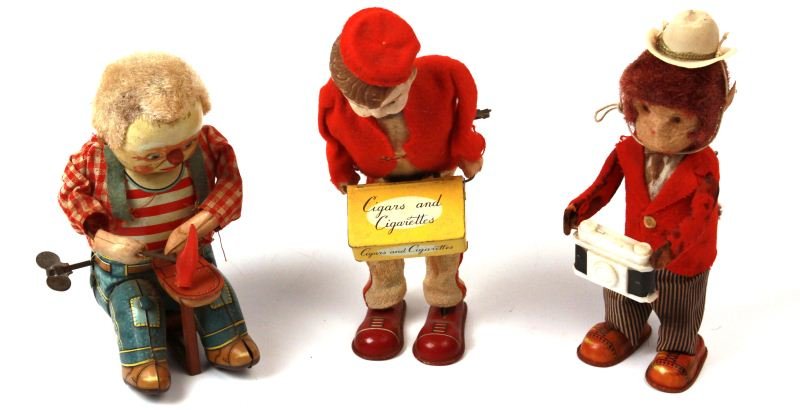 VINTAGE WIND-UP TOYS SHOE MAKER CIGARSELLER MONKEY: Made in Japan wind-up toys: tin litho shoemaker with cloth shirt (with mothing) in working condition. Cigar and Cigarette seller with shirt, pants, and hat with mothing, some mechanical problems. and 