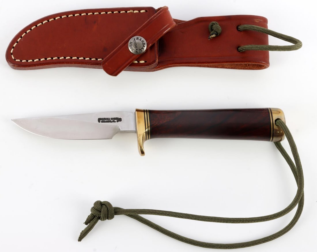 RANDALL MADE KNIVES 3 1/2 INCH BLADE WOOD GRIP: Stainless steel blade with hardwood grip. Brass pommel and finger guard. Overall, 7 5/8 inches. Comes with sheath.