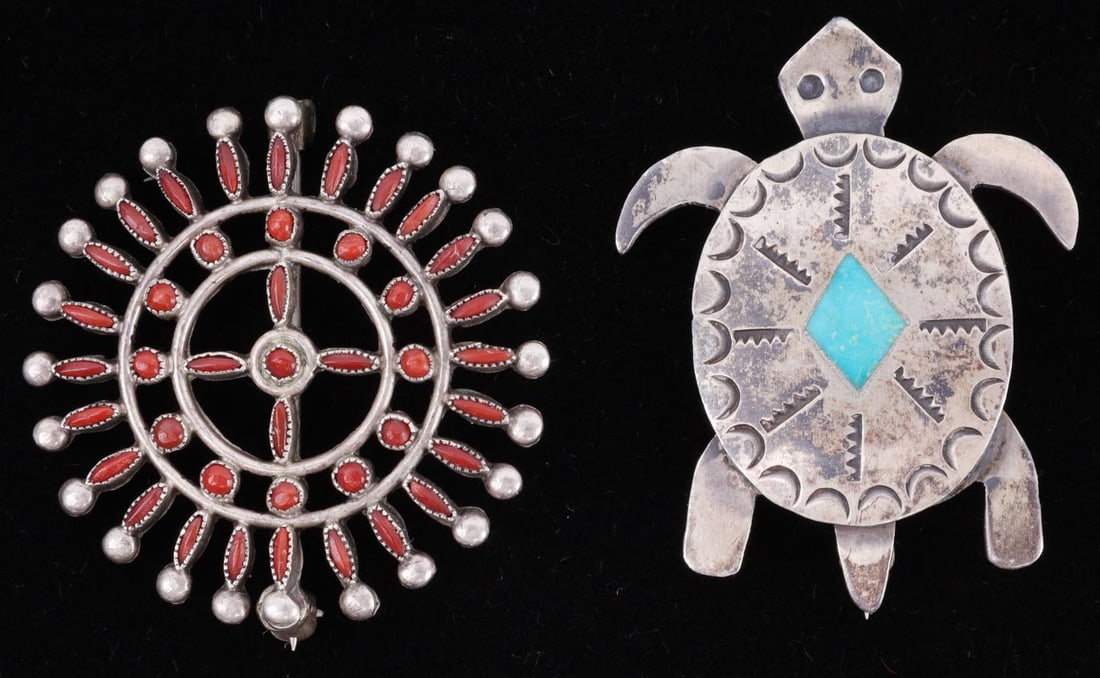 2 NATIVE AMERICAN NAVAJO STERLING SILVER PINS: Lot of two (2) Native American Navajo sterling silver pins. One pin features a turtle design with turquoise inlaid, vertical pinback. Second features circular ring designs with coral stones, vertical 