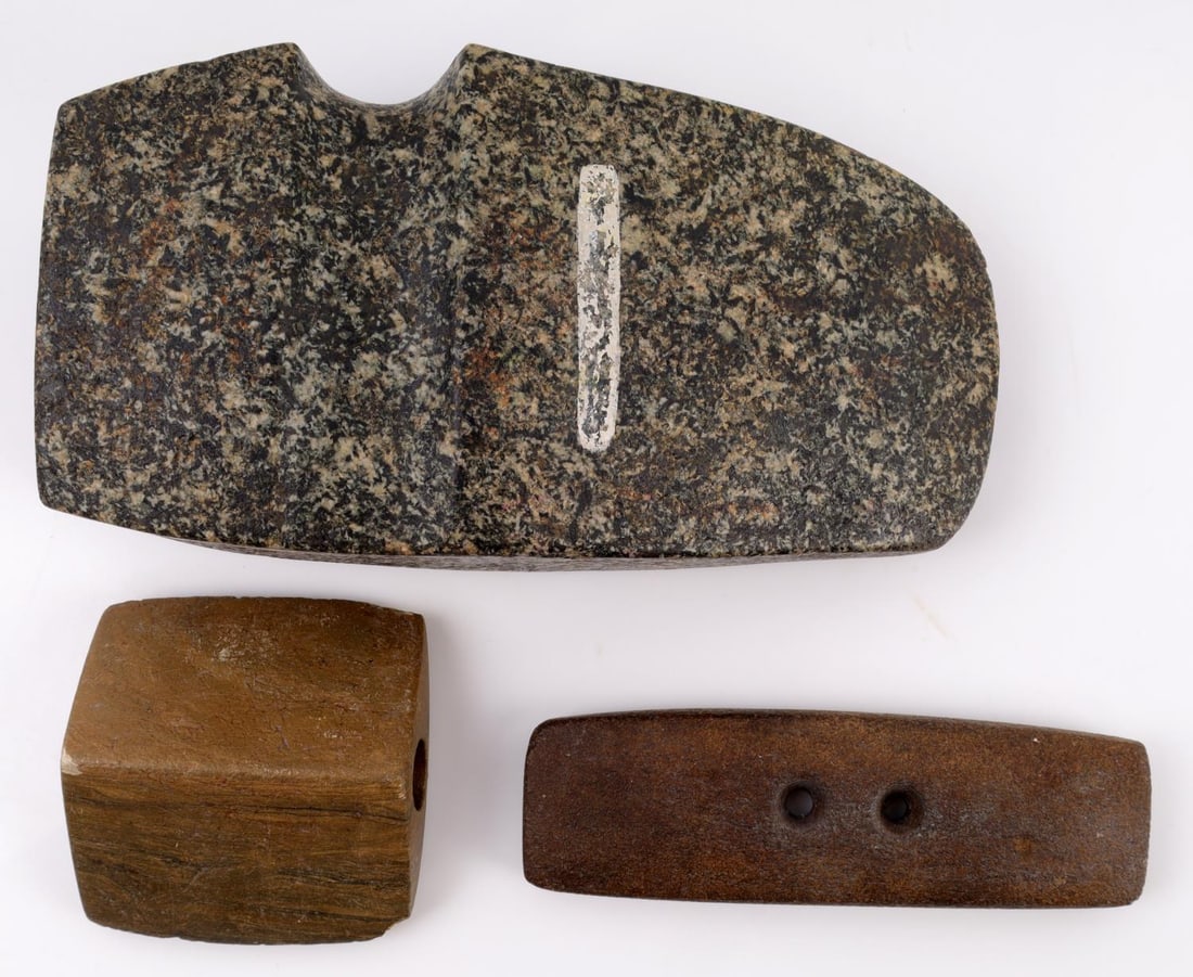 HOMAGE NATIVE GORGET BANNERSTONE & AXE HEAD: Lot of 3 homage Native American carved stone artifacts. Includes a rectangular gorget (5.25 X 1.75 inches), saddleback bannerstone (3 X 3 inches), and large basalt axe head (4 X 8 X 2 inches). Good co