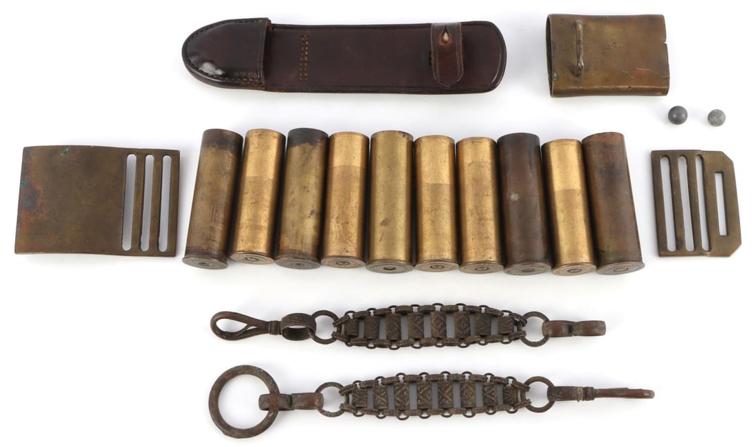 BRASS 12 GAUGE SHOTGUN SHELL LOT: Has an early belt buckle and a bayonet sheath part.