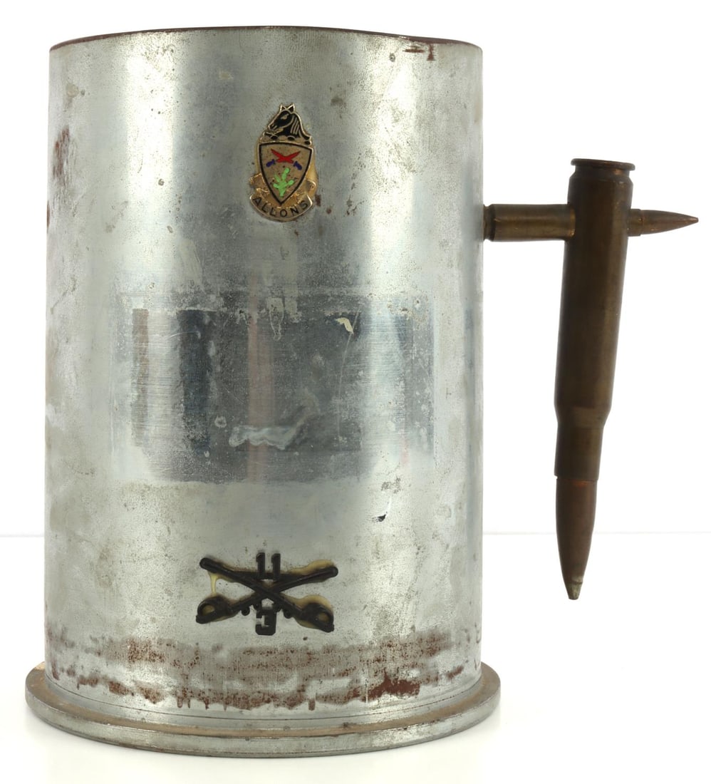 US ARMY 11TH ARMORED CAVALRY TRENCH ART 105MM: U.S. Army 11th Armored Cavalry Regiment Allons insignia crest on a 105mm M115B1 Steel Cartridge Case trench art mug. Handel is made from 2 bullets. Size 8 inches tall 5 2/3 inches across the base. Wei