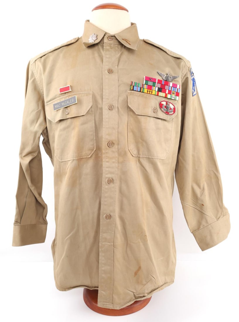 FLIGHT SURGEON MAC MCCALEB WWII DECORATED SHIRT: Airborne medic, and highly decorated shirt named to Mac McCaleb, Lt. Col. insignia, Airborne Patch, sterling Senior Jump Master wings, sterling Flight Surgeon wings, ribbons and more, shirt is size 15