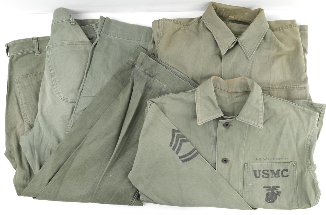 USMC MARINE WWII P41 & P44 HBT UNIFORM LOT: Two (2) sets with trousers, and shirt, 1st Sgt F.D. Williamson named, shirts are size 40 Regular trousers 32 X 32 inches. USMC Herring Bone Twill