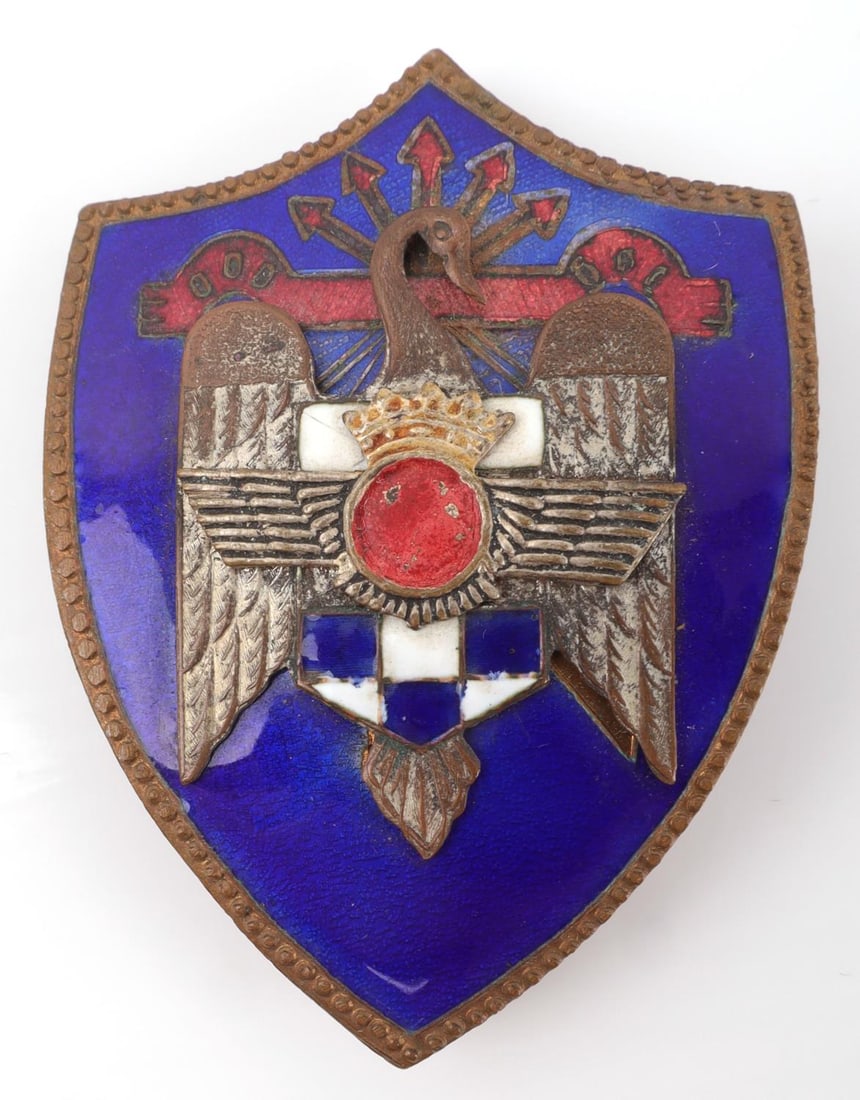 SPANISH CIVIL WAR FALANGIST AIR FORCE SHIELD BADGE: Spanish Falange SEU University Syndicate Air Force member pin-back enamel shield badge. Long pin and 2 hooks on reverse. Good condition, measures 2.5X1.75 inches. Unauthenticated, sold as-is.