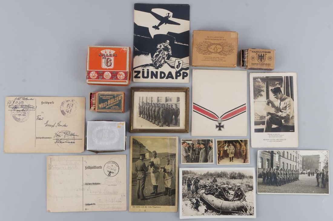 THIRD REICH CIGARETTE PACK & POSTCARD LOT OF 20: Lot of 20 items. Third Reich ephemera in good condition. Includes 3 unopened cigarette packets. Each packet has a tax stamp embossed with the Parteiadler, or Nazi eagle. Also includes 2 match boxes, 6