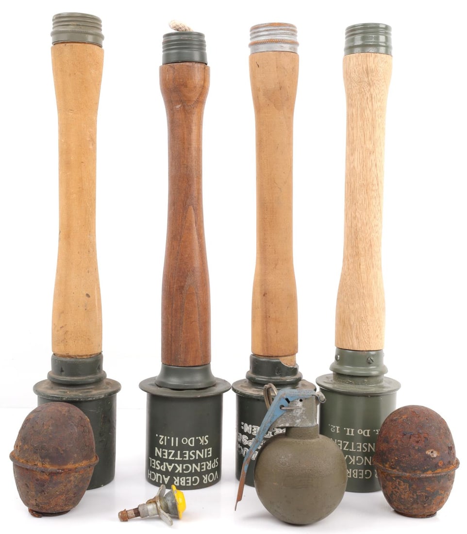 WWII GERMAN REICH LOT OF 4 REPLICA STICK GRENADES: Includes four (4) Steilhandgranate "Potato Masher" grenades of varying quality. All in mostly good condition. Includes three deactivated grenades, including: two German Egg grenades, and an M228.