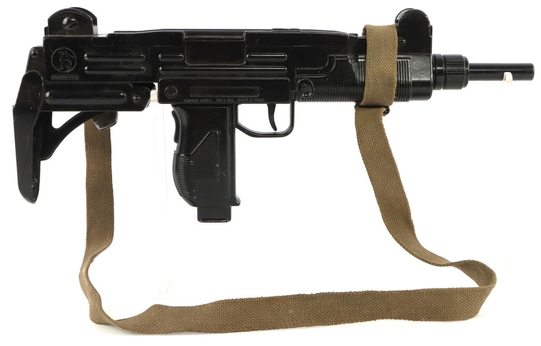 VINTAGE GONHER UZI SMG DIECAST LIFE SIZE PROP GUN: All metal prop cap gun in good condition. Not a firearm. Trigger cap mechanism in working condition. No rust or oxidation evident. The front carry strap mount is broken. Made in Spain. Overall length: