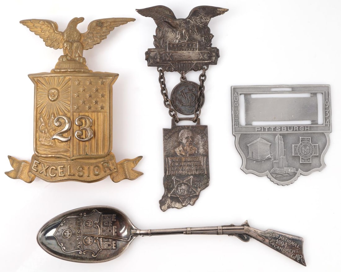 LATE 19TH CENTURY US VETERANS GAR EMBLEMS LOT: Late 19th century-early 20th century. Includes Bloomington Indiana 1920 encampment, 1894 GAR encampment spoon, and a New York "23 Excelsior" shako emblem plate. All in good condition, as photographed.