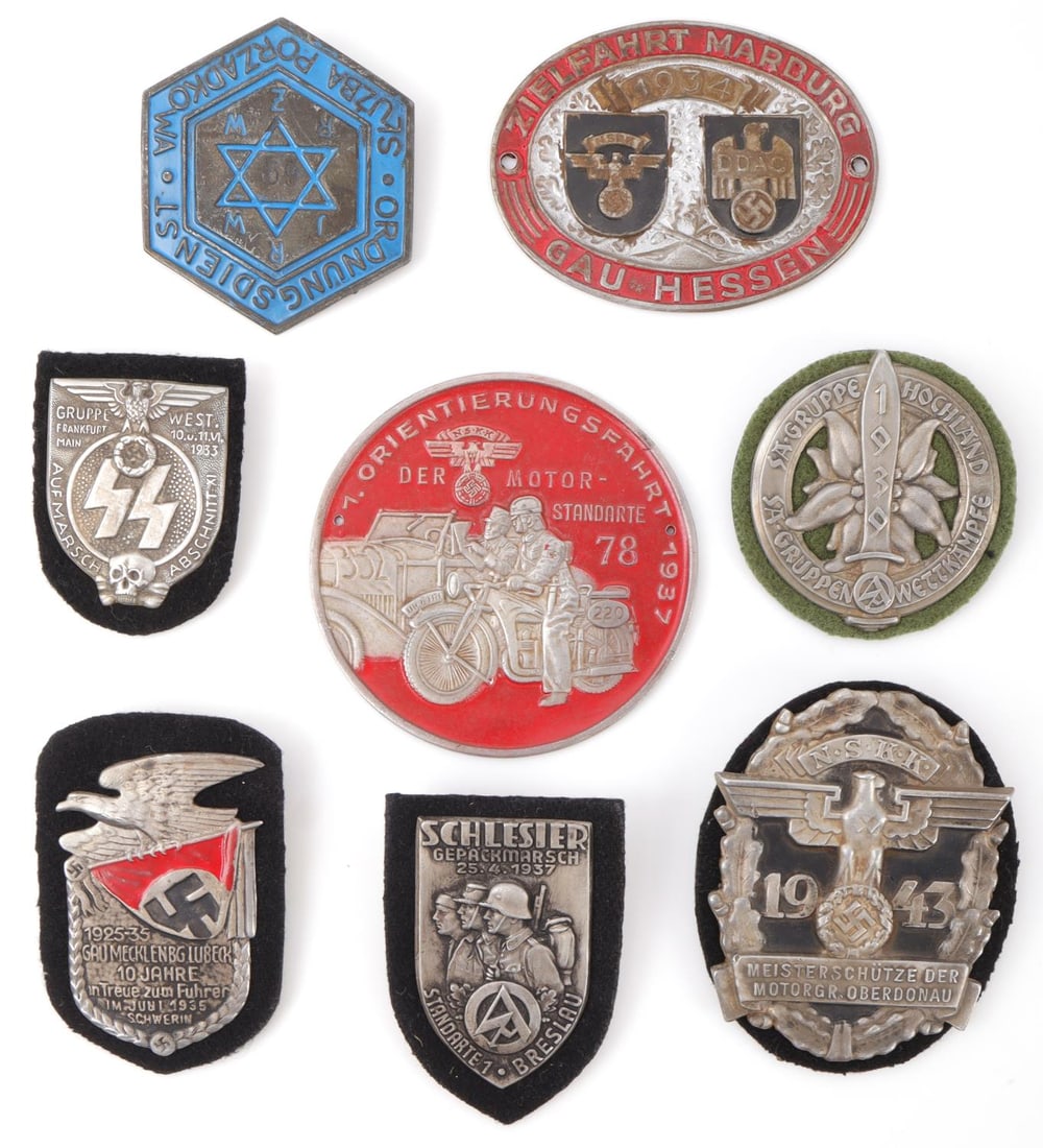 WWII GERMAN THIRD REICH SHEILDS & BADGES LOT OF 8: WWII German lot of 8 shields and badges. Warsaw Ghetto Police shield, 1943 NSKK Motorbrigade "Oberdonau", 1933 SS Gruppe "West" shield, 1937 SA Standarte "Breslau", 1935 10 Years to Hitler's Rally in 