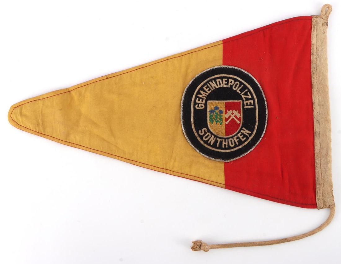 THIRD REICH GEMEINDEPOLIZEI SWASTIKA PENNANT FLAG: Original small pennant flag. Obverse has coat of arms of the Gemeindepolizei Sonthofen. Reverse has NSDAP swastika. Fabric does not fluoresce. Measures 9X14.5 inches. Good condition.