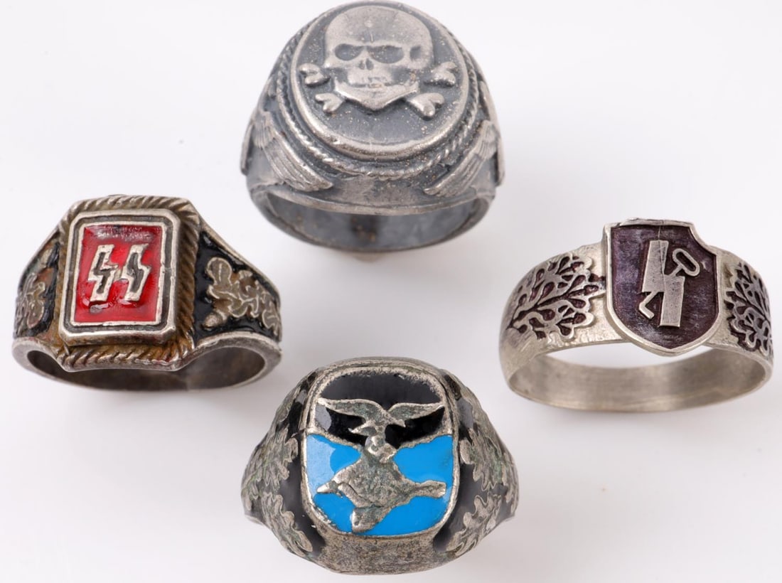 WWII GERMAN THIRD REICH SS LOT OF 4 SILVER RINGS: WWII German Luftwaffe Pilot ring size 11 1/2. Waffen SS ring size 11. SS 12th Panzer Division Hitlerjugend ring size 12. Waffen SS Totenkopf ring size 9. All in very good condition. Unauthenticated an