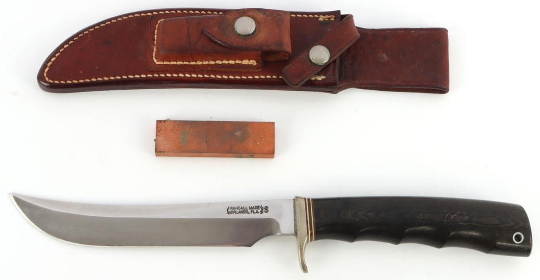 RANDALL MODEL 4 - 7 BIG SKINNER KNIFE: Stainless steel blade with Micarta grip. Name engraved on reverse. Comes with rough back sheath. Crack featured on spine. Very good condition otherwise.