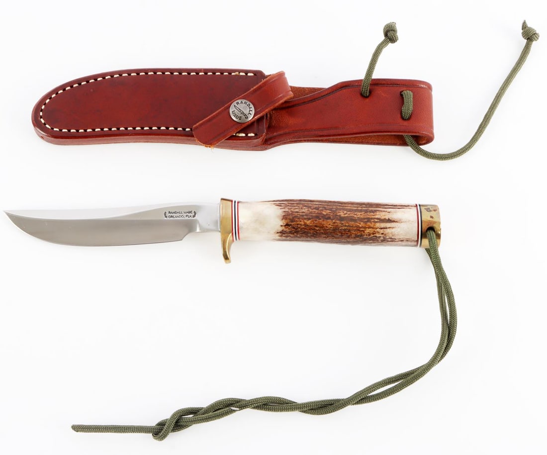 RANDALL MODEL 7 - 4 FISHMAN HUNTER KNIFE: Stainless steel blade with stag grip, brass finger-guard, and butt cap. Four inch blade. Overall length: 9 inches.