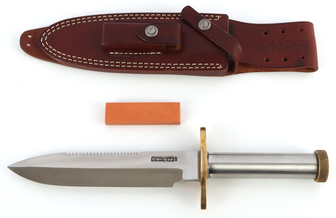 RANDALL MODEL 18 SURVIVAL FIGHTING KNIFE: Randall Made Model 18 Survival knife with sawtooth edge on top (sawteeth not offset). Stainless steel tubular knurled handle in 1 inch diameter. Silver soldered to 1/4 inch oblong brass hilt. Fitted w