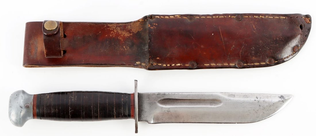 WWII US NAVY COMBAT KNIFE RH PAL 36 BRIGHT BLADE: WWII fixed blade knife with leather scabbard. Bright blade. Ricasso stamped "RH PAL 36, Made in USA." Shows wear from use. No play or looseness in the blade. Overall length 11 inches.