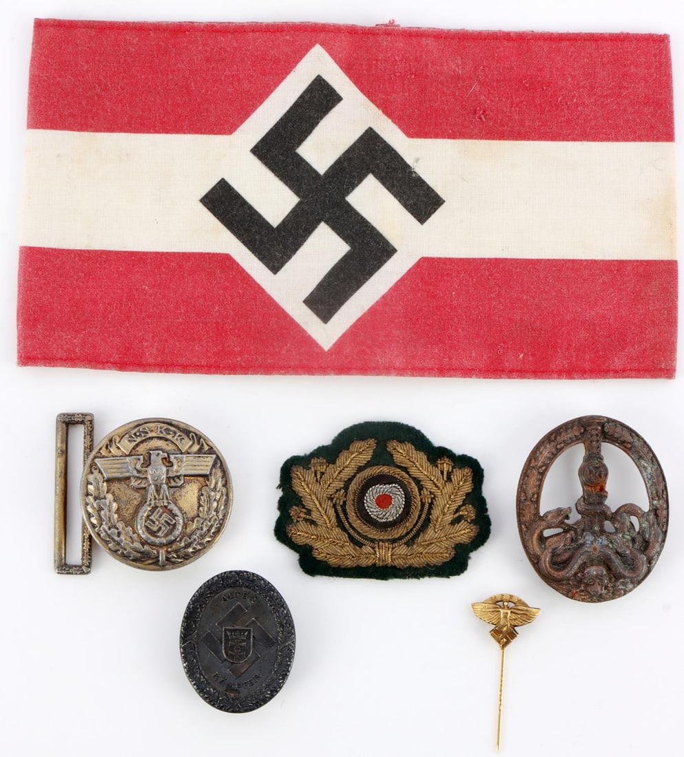 LOT OF WWII GERMAN ARMBANDS AND AWARDS: Features NSKK belt buckle, army cockade, anti-partisan badge, stick pin, and Hitler Youth armband. Good post- war variety.