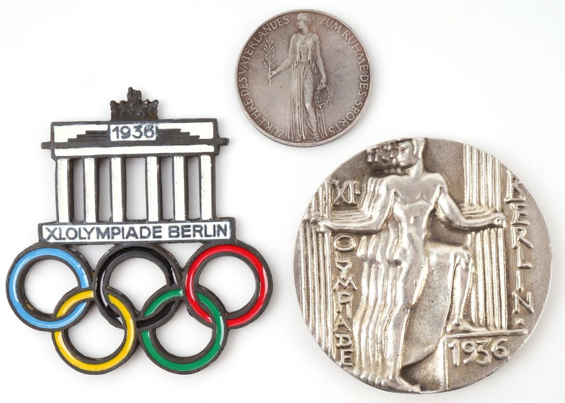 THIRD REICH 1936 BERLIN OLYMPICS MEDALLION LOT 3: Lot of three (3) pieces. 1936 Berlin Olympics Silver toned medallion (2.75 inches diameter), commemorative token (1.5 inches diameter), and enamel Brandenburg Gate Olympics medallion (3X3 inche). Grou