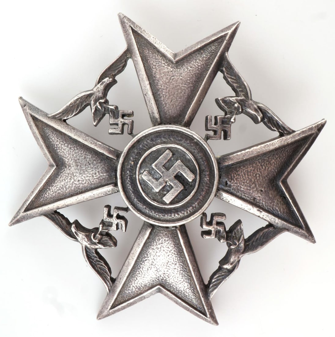 WWII GERMAN THIRD REICH SPANISH CROSS: Spanish Cross. Non-combatant version of the Spanish Cross in the silver class. A Maltese cross with four Luftwaffe eagles and a central circle with a swastika. Maker's mark 'GV' on bottom. 2.5 X 2.5. 