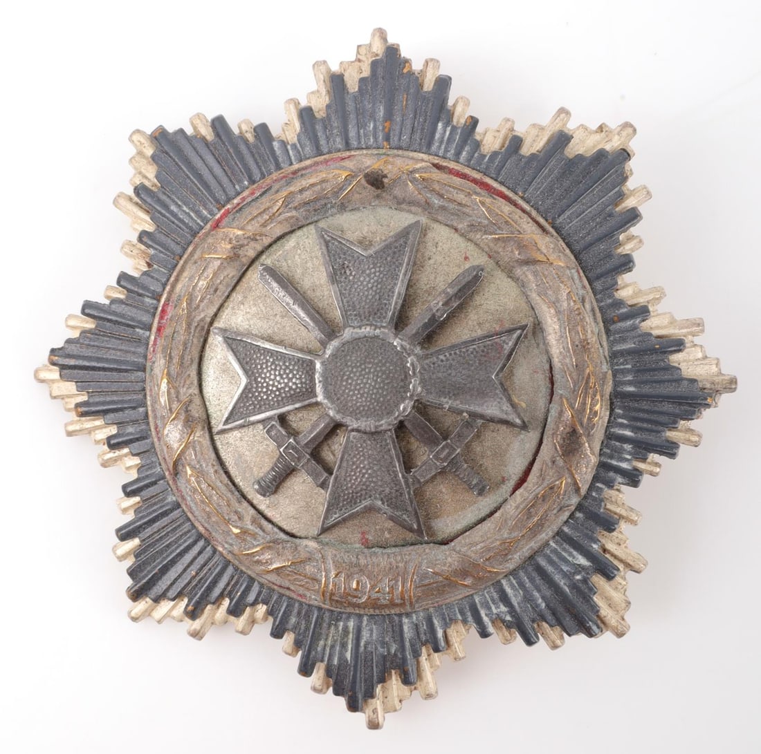 WWII GERMAN VETERAN GERMAN CROSS MEDAL: War merit cross with swords in place of swastika. Multi-piece construction. No maker's mark. Measures 2 1/2 inches. Patination present.