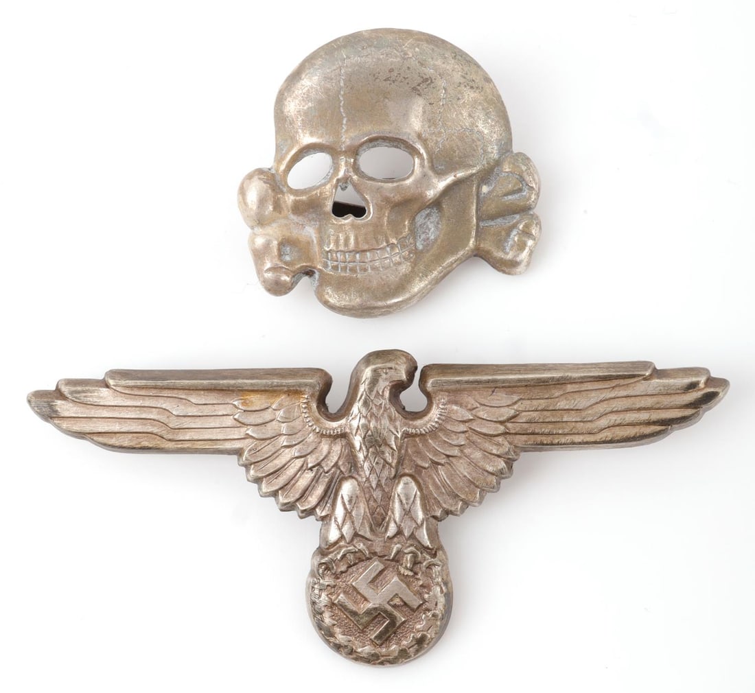 WWII GERMAN SS VISOR PIN SET TOTENKOPF & EAGLE: Silvered nickel and zinc set. Reichsadler marked RZM M1/8, totenkopf marked DSM Ges Gesch. They measure 1 and 2 3/4 inches. Very good condition. This lot has a reserve.