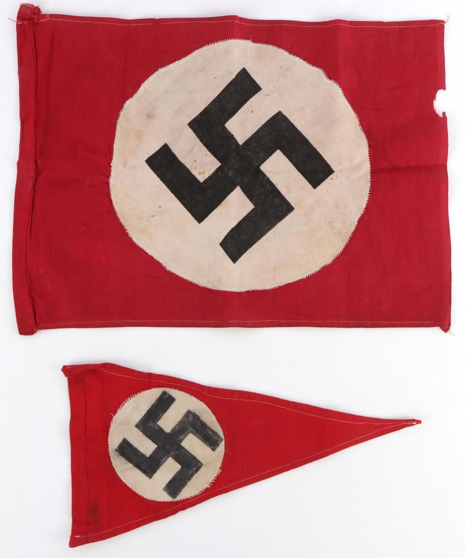 WWII GERMAN THIRD REICH FLAG AND PENNANT LOT OF 2: German Third Reich pennant with swastika. Cotton. Fluorescing. 6.5 X 12 inches. Unauthenticated, sold as is. Very good condition. German Third Reich flag with swastika. Cotton. Fluorescing. 15 X 10 in